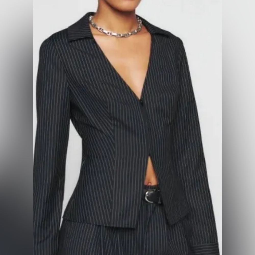 Navy blue striped Reformation shirt. Zipper detail in front.